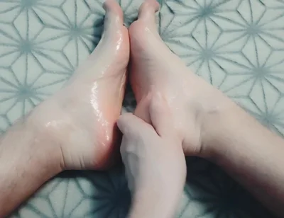 Guy Gently Massages His Feet with Oil