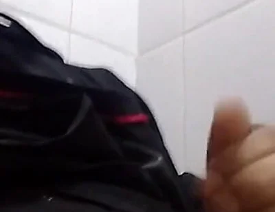 Man Sits in the Bathroom