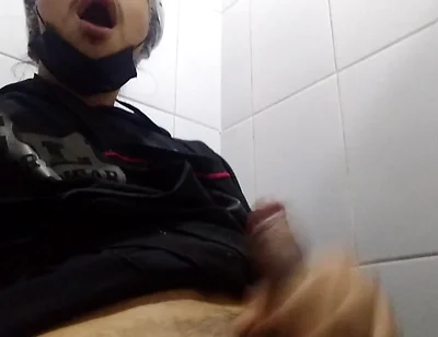 Man Sits in the Bathroom