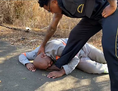 Vigilante Humiliating the Worker