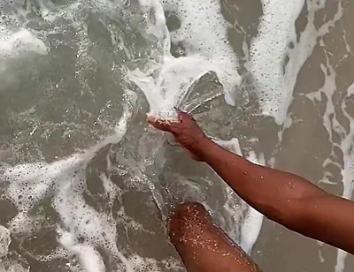 Having Fun on the Beach of Cotonou Alone for the First Time