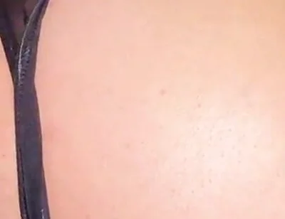 A Gay Man Dressed as a Woman Moves in a Seductive Manner.