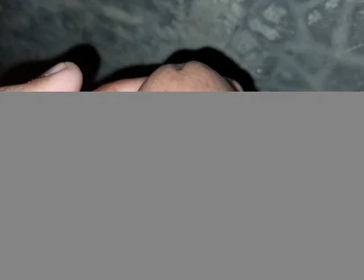 The Gay Boy Went to the Toilet, Turned on the Flash Light on His Mobile Phone, and Started Licking His Private Parts with Spit.