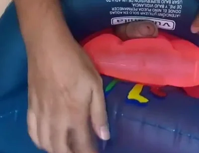 Playing with inflatable swim ring