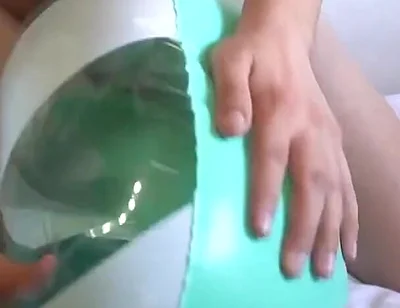 Playing with a Green and White Swimring