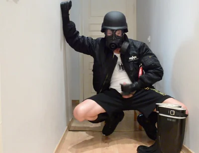 Gas masked guy cums on his rubber boots