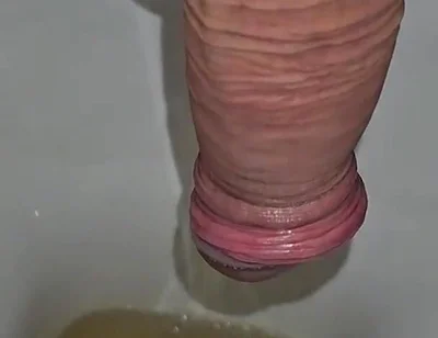 Male Peeing Into the Toilet
