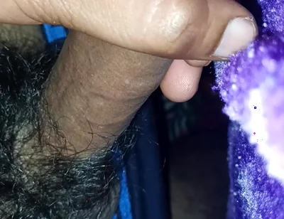 A Indian Young Boy Is Playing with His Penis Inside a Blanket