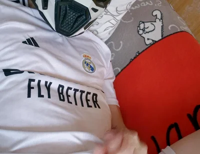 The Guy Is Wearing a Soccer Uniform and Mxhelmet with a Morning Cum