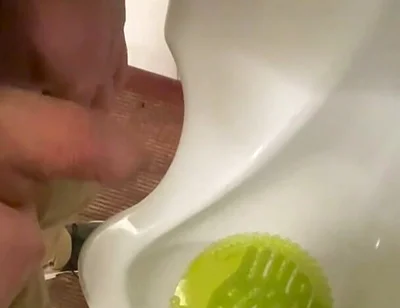 Amateur Redhead Guy Caught Pissing in a Public Toilet's Urinal - He Then Quickly Plays with His Cock Before Leaving