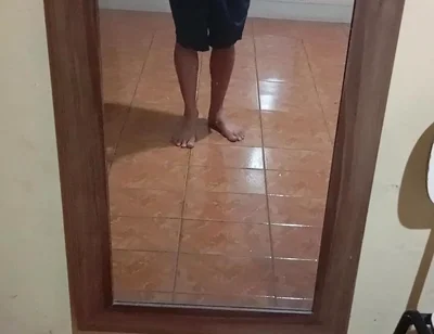 Boy in Shorts in the Mirror
