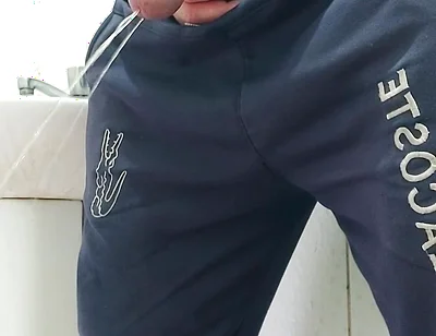 A Well-endowed Brazilian Man Urinating and Showing His Thick Penis to His Female Friends.