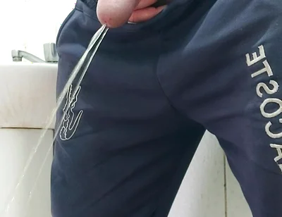 A Well-endowed Brazilian Man Urinating and Showing His Thick Penis to His Female Friends.