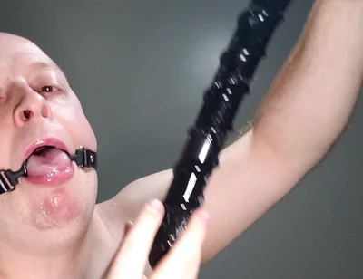 Deepthroating an 18 Inch Dildo with Mouth Gag Ring