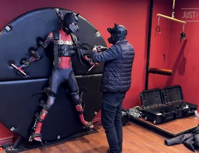 Pup Twink Dressed as Spider-man Strapped to the Bondage Wheel and Milked