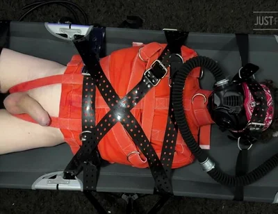 Bondage Twink Strapped to Campbed in Straitjacket and Gas Mask