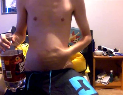 Young Guy Fills His Stomach with Water