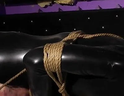 Roped in Latex: Zeus Struggles to Break Free
