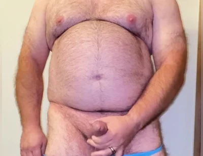 Anal Steve in His Blue Thong Showing off His Bear Body and Cock, with a Cock Ring on and Showing His Massive Butt Plug
