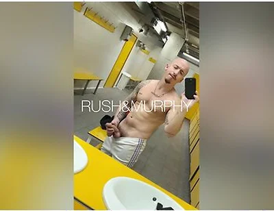 He Masturbates His Huge Cock In The Gym Showers While Muscular Straight Man Spies On Him