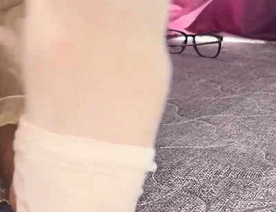 A University Rests Her Feet on Her Face so That the Adorers