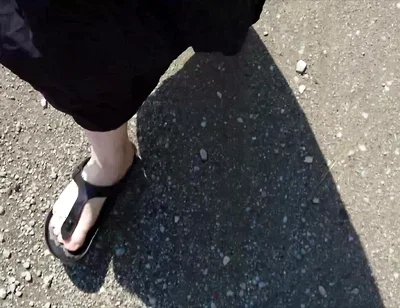 Outdoor in a Black Caftan and Barefoot in Black Birkenstocks