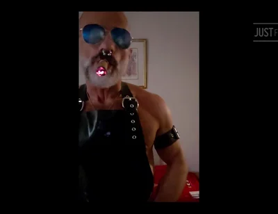 Stepdad lighting his Cigar in rubber apron