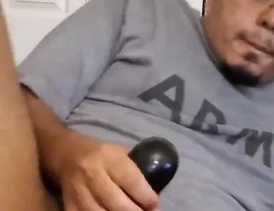 Browndicksavior Using His Oral Sex Toy and Stroking His Brown Cock