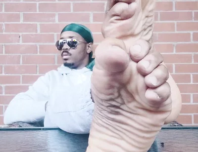 I Expose My Feet and I Touch Them