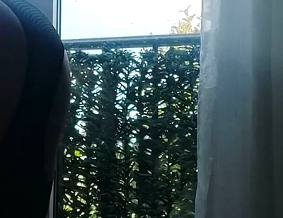 In Lingerie and Heels at the Window with a Toy