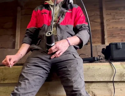 Farmer Smokes and Milks Himself with the Milking Machine