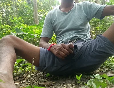 Indian mature masterbating in forest.