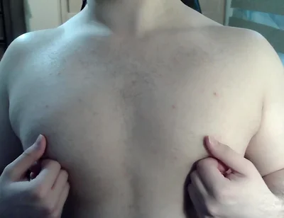 Muscular jock plays with his nipples on cam