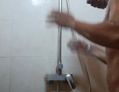 Exotic Skinned Asian Adult Man Taking a Shower in the Morning