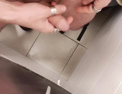 Jerking off a Cock in a Public Toilet